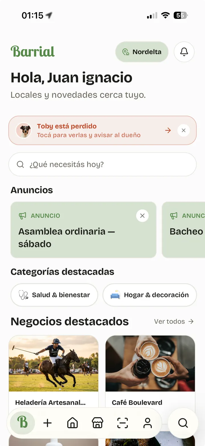 Pantalla de inicio de Barrial con saludo, alerta de mascota perdida, búsqueda y comercios destacados
